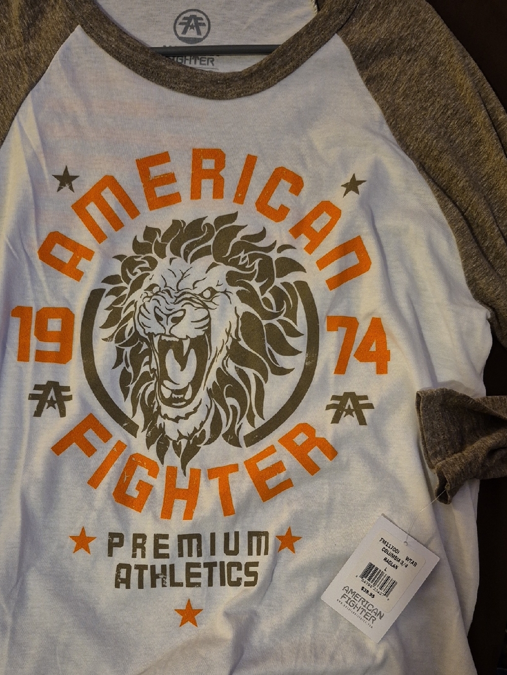 American Fighter White Raglan Tee with Orange and Olive Lion Graphic